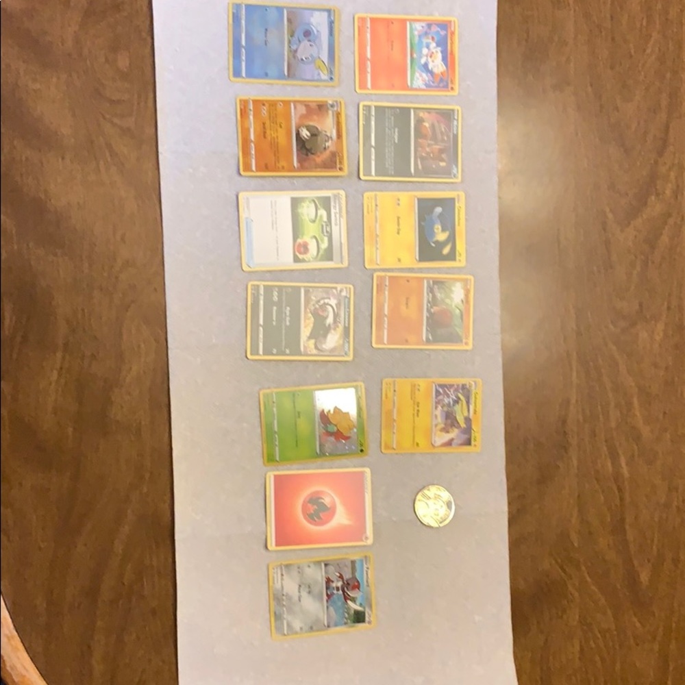 Pokémon trading cards with coin